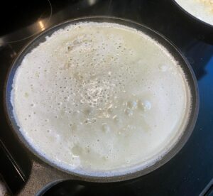 Bubbly Swedish pancake, ready to flip over